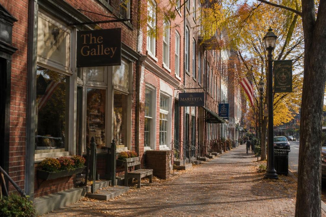 Historic brick storefronts on a Marietta, Ohio street in autumn